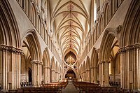 Nave of Wells Cathedral, with its strong horizontal emphasis. The unusual double arch was added in 1338 to reinforce the support of the tower.