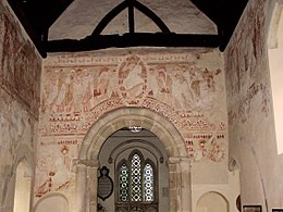 In England the major pictorial theme occurs above the chancel arch in parish churches. St John the Baptist, Clayton, Sussex