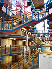 Polychromy and highly saturated colours – Main hall of the Judge Business School, University of Cambridge, England, by John Outram (1995)[49]