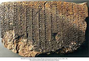 a clay tablet with cuneiform writing