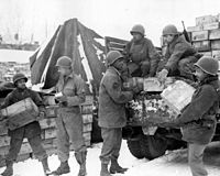 Soldiers of the 4185th Quartermaster Service Company loading Red Ball Express truck, Liège, Belgium, 1944