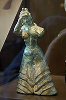 Bronze Minoan figure in Berlin, LM I, probably a worshiper, with either snakes or tresses of hair.[9]