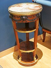 Neoclassical bucrania on a gueridon (small high table) from the salon of madame Récamier, c.1790, mahogany, gilt bronze and marble, Louvre[11]