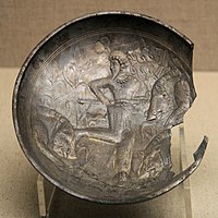 A probable Kushano-Sasanian plate with hunting scene, found in the 504 CE tomb of Feng Hetu in China. Shanxi Museum. It is dated the 3rd-4th century CE, and was probably manufactured in northern Afghanistan.[15][16][17]