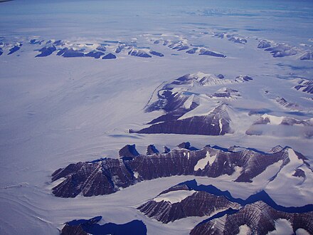 Southward bend in the Christian IV Glacier with the Gronau Nunataks in the background and the northwest part of the Watkins Range on the right