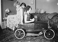The Brox Sisters, posed with toy car. Left to right: Loryane, Bobbe, Patricia