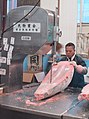 Cutting frozen tuna with a band saw