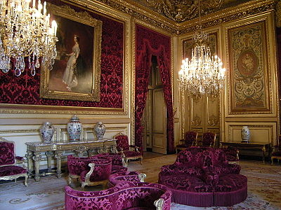 One of the salons of Napoleon III, now in the Louvre, in the Second Empire Style. The chair in the foreground, designed for intimate conversations among three persons, was called l'indiscret, or "the indiscreet".
