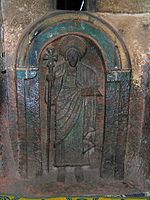One of the seven life-size saints carved into the wall of the Church of Bet Golgotha, Lalibela, 15th century (traditionally believed to have been made during the reign of Gebre Mesqel Lalibela)[123]