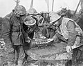 Canadian artillerymen with Xmas message on 60 pdr shell, Somme, November 1916