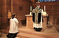 A Roman Catholic priest standing at the Epistle side during the offering of a Tridentine Mass
