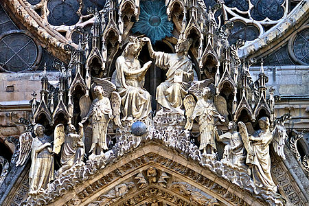 Sculpture over the central portal: the crowning of the Virgin Mary