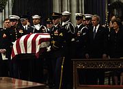 The casket of former President Gerald Ford is carried past President George W. Bush and First Lady Laura Bush during Ford's state funeral at the National Cathedral in Washington, D.C., January 2, 2007.