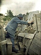 A 1917 Autochrome color photograph of a French Army lookout at his observation post during World War I.