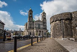 From centre: the Church of Saints Peter and Paul sits on the bank of the River Shannon; Athlone Castle