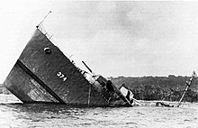Naval ship struck by a mine and sinking