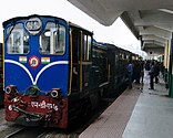 Blue diesel train at a station
