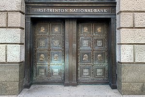 Bronze doors at One West State Street, featuring bas-relief portraits of George Washington, Marquis de Lafayette, Alexander Hamilton, and Benjamin Franklin.