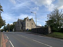 View up the road towards Kirknewton Parish Church