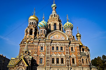 The Russian Revival façade of the Church of the Savior on Blood is of red brick decorated with mosaics, glazed tiles and architectural ornament, particularly the ogee arches known as kokoshniks.