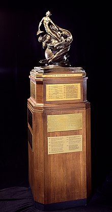 Baltimore sculptor Ernest Wise Keyser crafted the 525 pounds (238 kg) Aero Club Trophy. It was officially renamed the Robert J. Collier Trophy in 1944