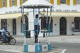 Policeman directing traffic from the Birdcage at Heyl's Corner, on Front Street in Hamilton, 2001