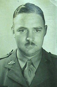 a head and shoulders mugshot of a male in uniform