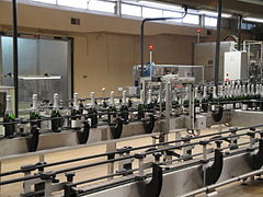 Automated labeling line for wine bottles