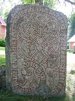 U 1163, the Drävle runestone, showing Sigurðr slaying Fáfnir.