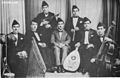 Image 12Iraqi music group led by Yusuf Za'arur in Baghdad, wearing the sidara, ca 1930. (from Music of Iraq)