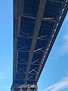 The underside of the bridge deck, showing the multiple trusses that make up each segment