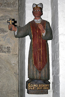 A wooden statuette of Bishop Egino
