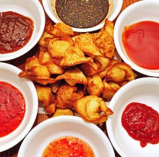 In the wonton shape, surrounded by dipping sauces