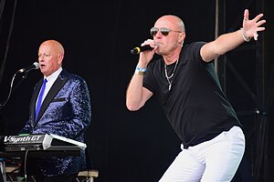 Heaven 17 performing live in Liverpool in July 2021 Left to right: Martyn Ware (keyboards), Glenn Gregory (vocals)