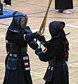 Two kendōka in tsuba zeriai