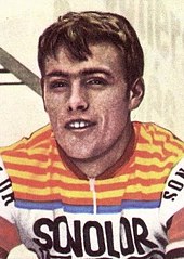 Portrait of Lucien Van Impe wearing a yellow and orange jersey with Sonolor insignia