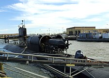 An SDV being loaded aboard Los Angeles-class attack submarine USS Dallas