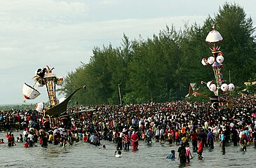 Submerging tabuiks on Ashura in a mock funeral of Husayn, Indonesia