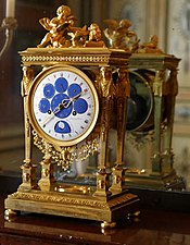 Astronomical clock; by Philippe-Jacques Corniquet; c.1794; gilt bronze and enamel face; unknown dimensions; Musée des Arts décoratifs, Paris[73]