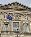 The European Flag is placed on numerous municipal flagpoles in Paris, on a par with the flag of France; here in front of the Louvre Palace.