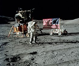 The first image is a successful moon landing in full color containing the American flag, an astronaut, a lunar rover, and a lunar landing module. The second image is an emblem containing a statue of the Greek god Apollo, red stripes inside an eagle made of white lines, the Moon, Saturn, and a spiral galaxy; along the outside of the emblem are is the word "Apollo" along with the number "seventeen" in roman numerals, and then the name "Cernan," "Evans," and "Schmitt." The third and final image contains Schmitt on the left, Cernan in the middle and sitting, and Evans behind Cernan.