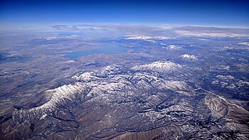 Mount Nebo (left of center) aerial view from the south, with Utah Lake and the rest of the Wasatch Range in the background and the Great Salt Lake on the far left horizon