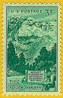 Green 3-cent postage stamp showing people looking at Mount Rushmore