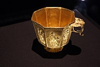A Tang octagonal gold cup with a thumb plate at the top of its handle, manufactured probably in Yangzhou, Jiangsu