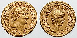 Two golden coins with faces and inscriptions