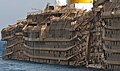 Starboard side of the righted Costa Concordia, showing crush damage from the rock spurs upon which she had rested