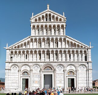 Pisa Cathedral, Italy. The entire building is faced with marble striped in white and grey. On the façade this pattern is overlaid with architectonic decoration of blind arcading below tiers of dwarf galleries. The three portals became increasingly common.