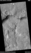 Channel system that travels through part of a crater, as seen by HiRISE under HiWish program