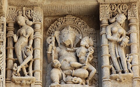 Ganesha with his consort and Apsaras