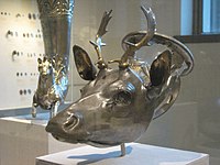 The Stag's Head Rhyton dating to 400 BCE, the largest so far known of recent examples, recently surrendered and worth $3.5 million, originally rediscovered in the 20th century after rampant looting in Milas, Turkey[14][15][16]